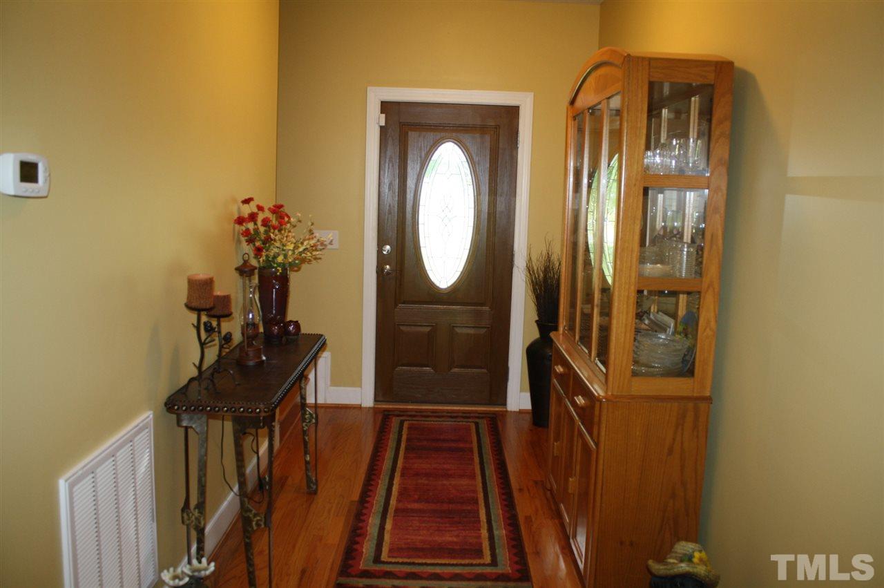 385 Huford Harris Road Spring Hope, NC 27882 - Photo 3 of 25 Welcome to this lovely, well-maintained 1.5 story home. Home boasts beautiful hardwood flooring in the entry foyer.