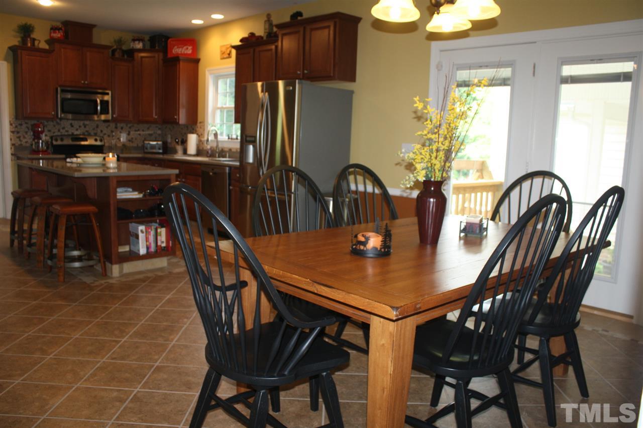 385 Huford Harris Road Spring Hope, NC 27882 - Photo 10 of 25 This lovely dining area is open to the kitchen and leads to the outdoor patio and breezeway.