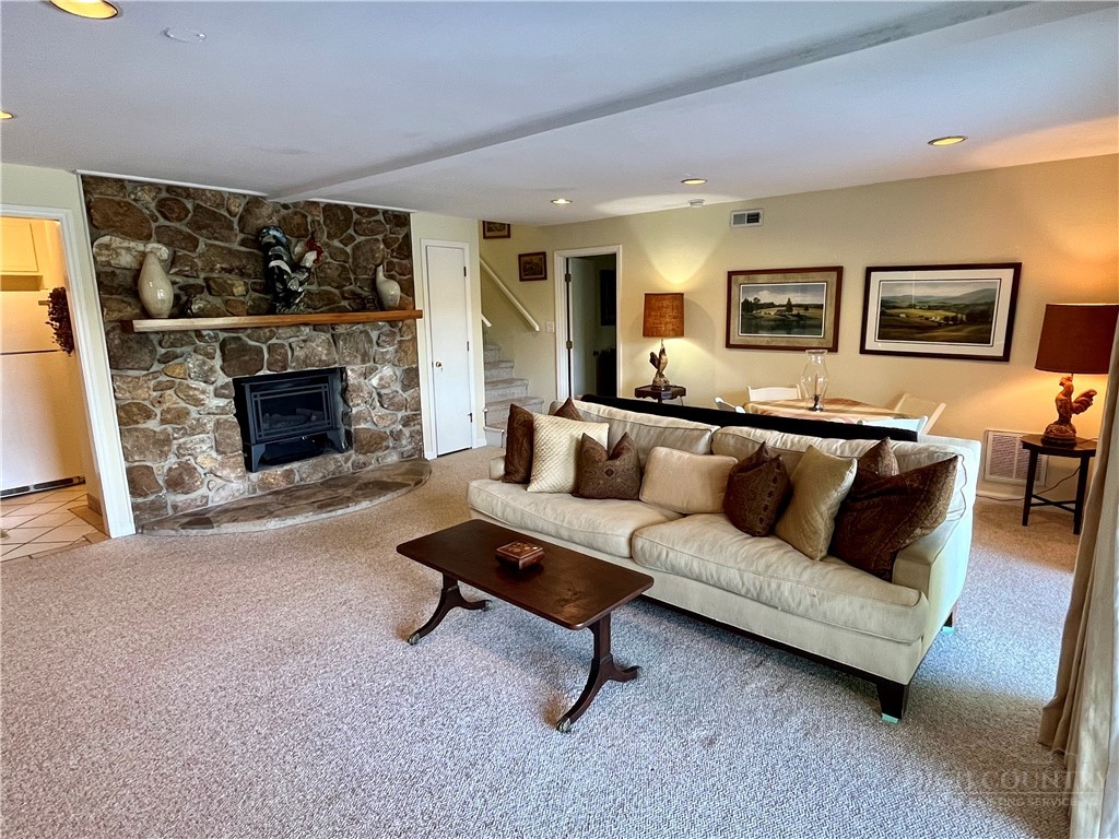 638 Ridge Road Glade Valley, NC 28627 - Photo 26 of 44 a living room with furniture and a fireplace