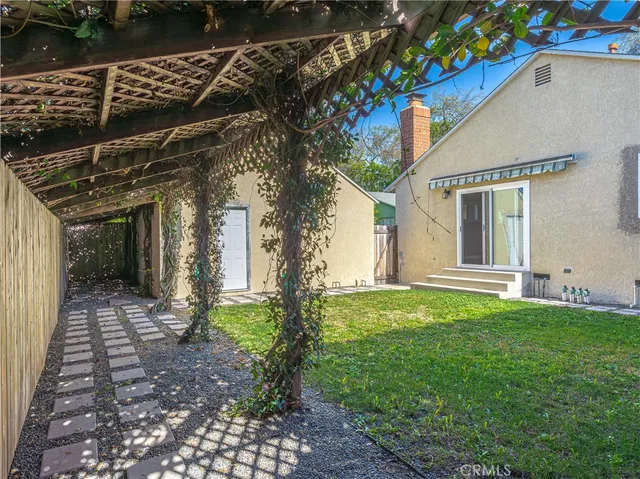 a house with garden in front of it