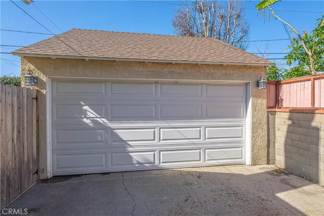 a view of house with stairs and wooden fence