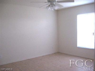 2312 Park Road Lehigh Acres, FL 33971 - Photo 5 of 10 an empty room with a window