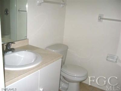 2312 Park Road Lehigh Acres, FL 33971 - Photo 6 of 10 a bathroom with a sink and a toilet