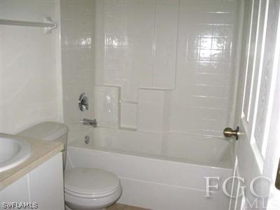 2312 Park Road Lehigh Acres, FL 33971 - Photo 8 of 10 a bathroom with a toilet and a shower