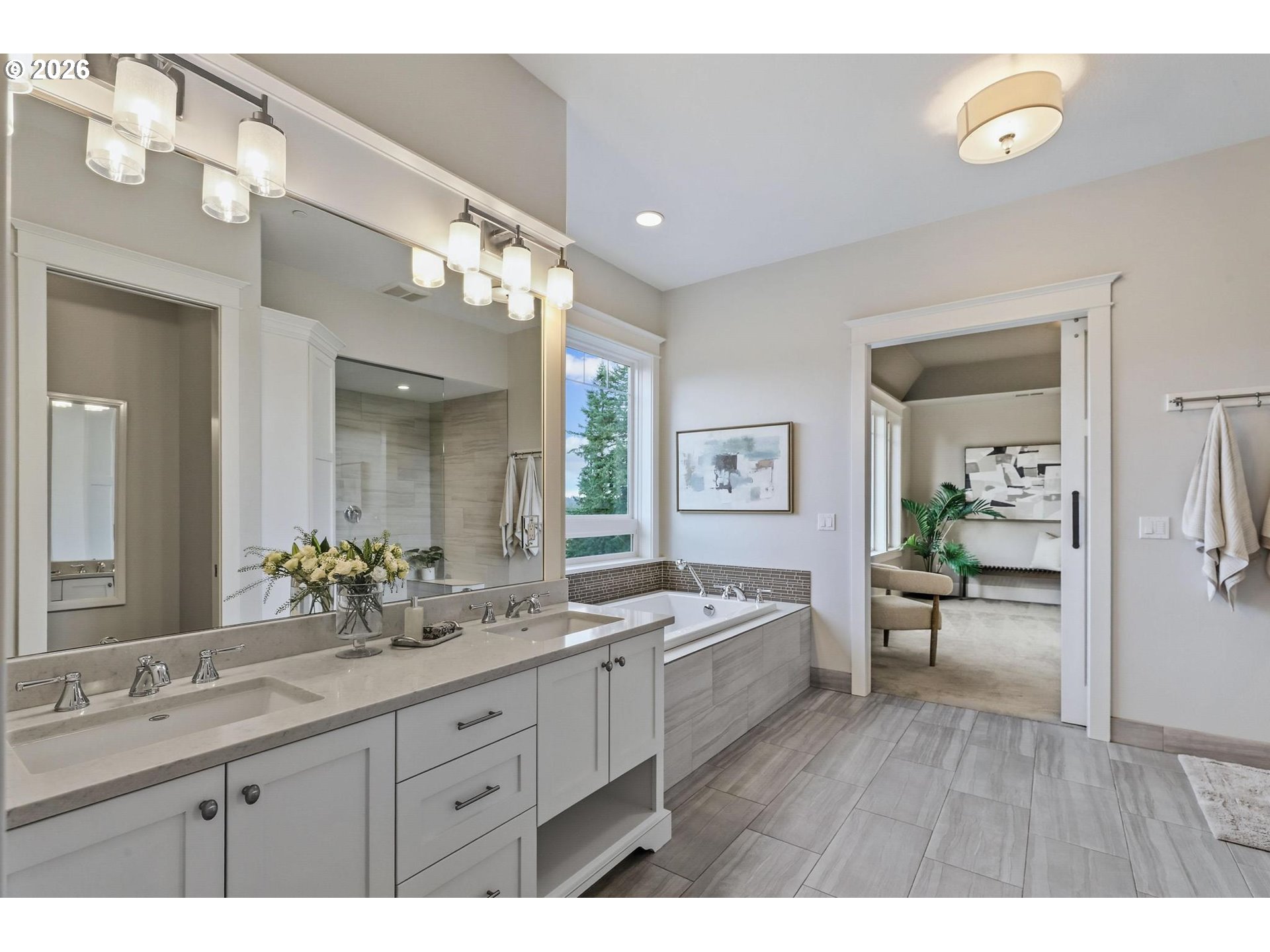 23875 Southwest Newland Road Wilsonville, OR 97070 - Photo 15 of 40 a spacious bathroom with a granite countertop sink mirror and bathtub