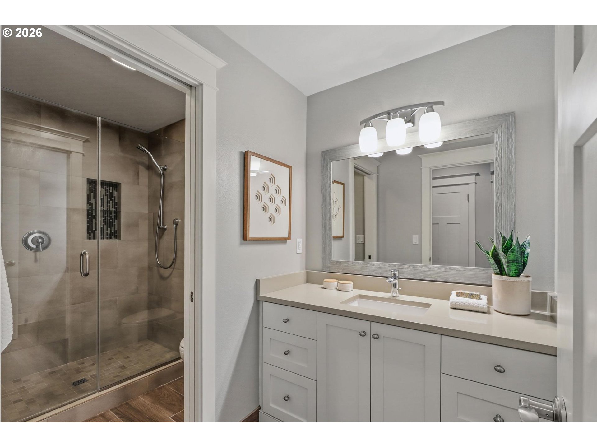 23875 Southwest Newland Road Wilsonville, OR 97070 - Photo 21 of 40 a bathroom with a double vanity sink mirror and shower