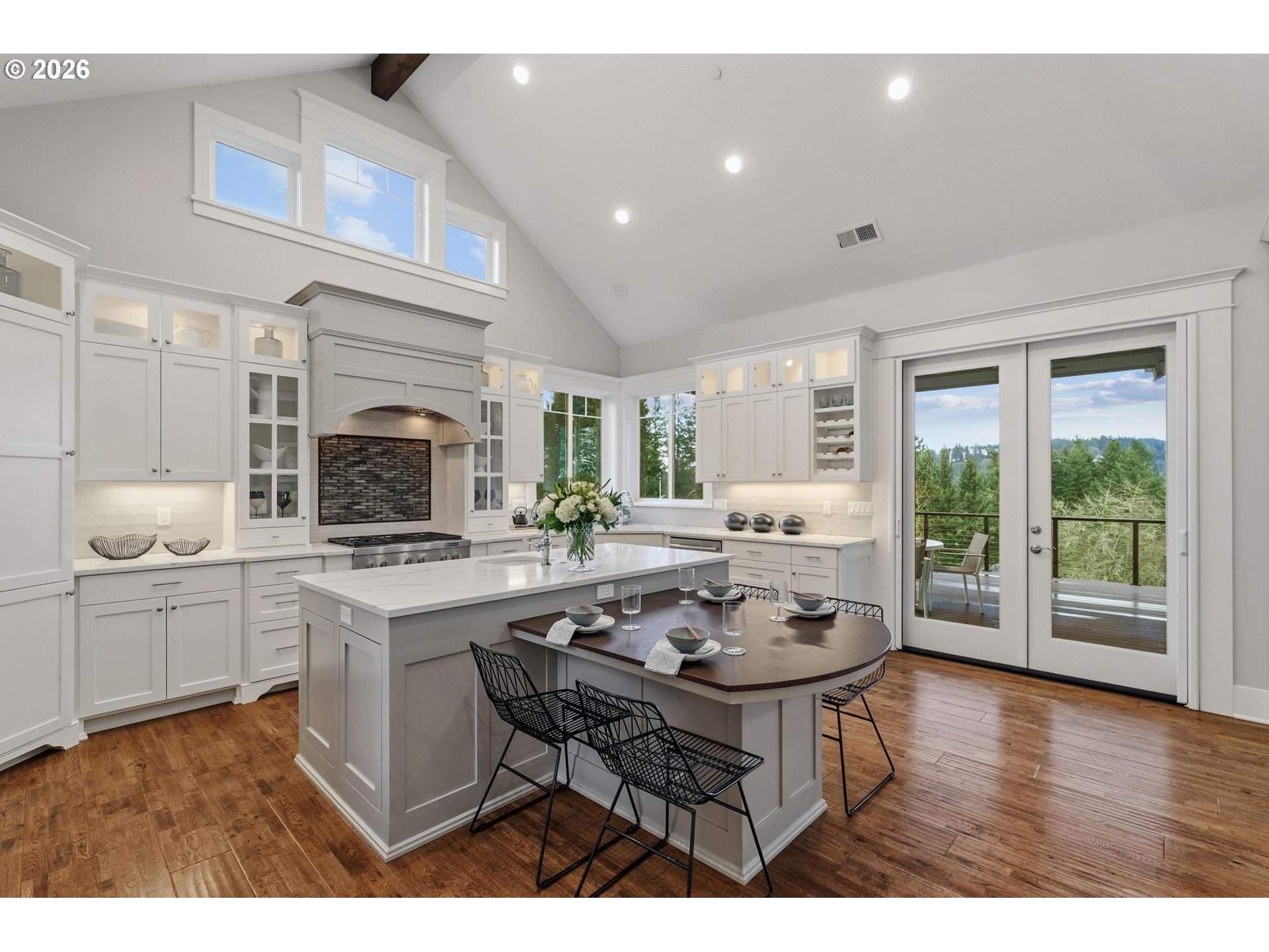 23875 Southwest Newland Road Wilsonville, OR 97070 - Photo 6 of 40 a kitchen with a table chairs stove and cabinets