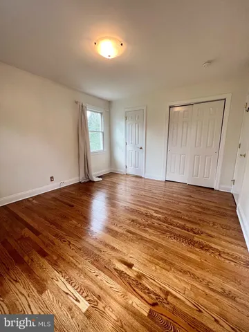 a view of room with wooden floor