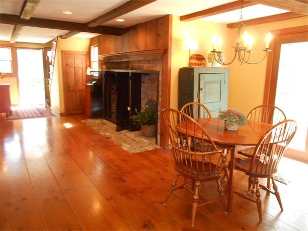 119 Service Road Sandwich, MA 02537 - Photo 12 of 29 a view of a patio with table and chairs and potted plants