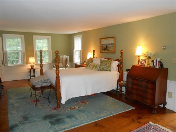 119 Service Road Sandwich, MA 02537 - Photo 17 of 29 a bed room with a bed window and a table