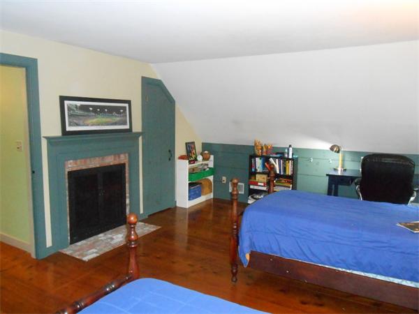 119 Service Road Sandwich, MA 02537 - Photo 18 of 29 a view of a livingroom with furniture and a fireplace