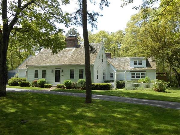 119 Service Road Sandwich, MA 02537 - Photo 2 of 29 a front view of house with yard outdoor seating and green space