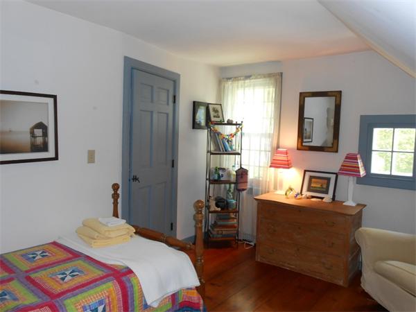 119 Service Road Sandwich, MA 02537 - Photo 21 of 29 a bedroom with a bed and a couch