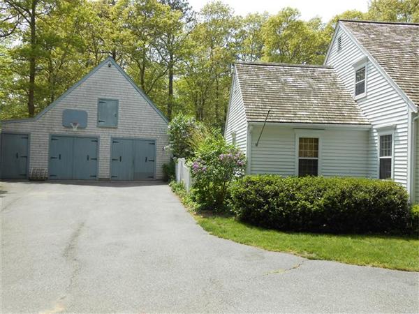119 Service Road Sandwich, MA 02537 - Photo 3 of 29 a view of a house with a yard and plants