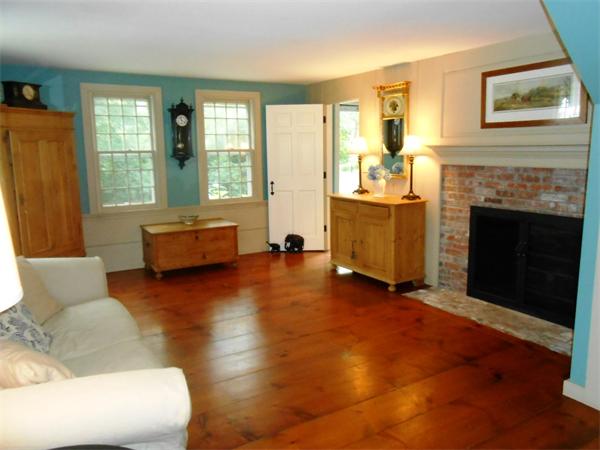 119 Service Road Sandwich, MA 02537 - Photo 4 of 29 a living room with furniture and a fireplace