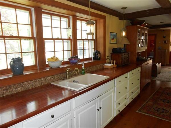 119 Service Road Sandwich, MA 02537 - Photo 9 of 29 a spacious bathroom with double vanity and a large mirror