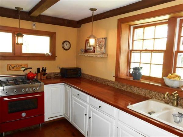 119 Service Road Sandwich, MA 02537 - Photo 10 of 29 a kitchen with a sink stove and microwave