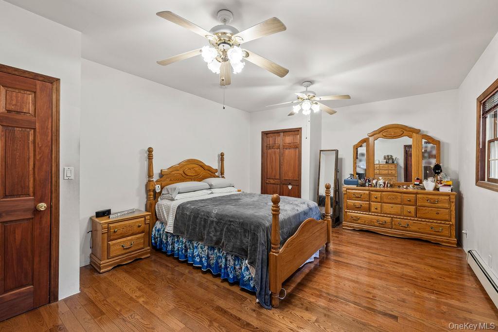 289 Seven Springs Mountain Road Monroe, NY 10950 - Photo 14 of 25 a bedroom with a bed ceiling fan and a dresser