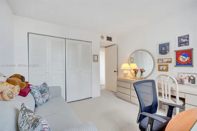 a bathroom with a double vanity sink toilet and shower