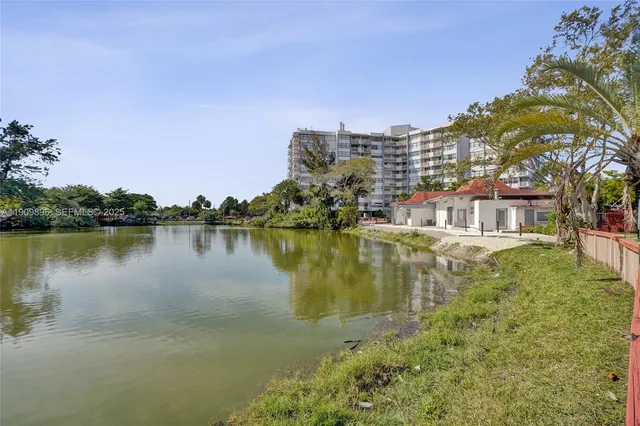 a view of a street with a cars park side of a road