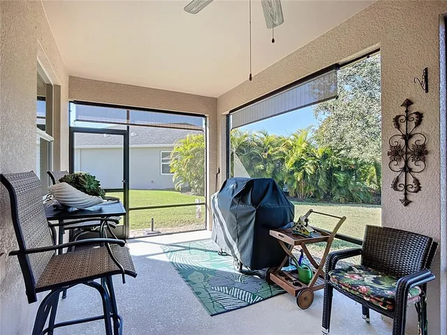 a view of a house with yard swimming pool and outdoor seating