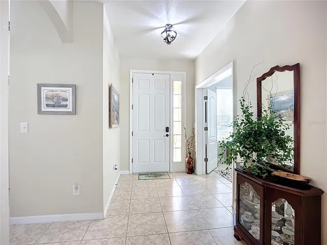 a kitchen with stainless steel appliances granite countertop a stove top oven a sink dishwasher and a refrigerator