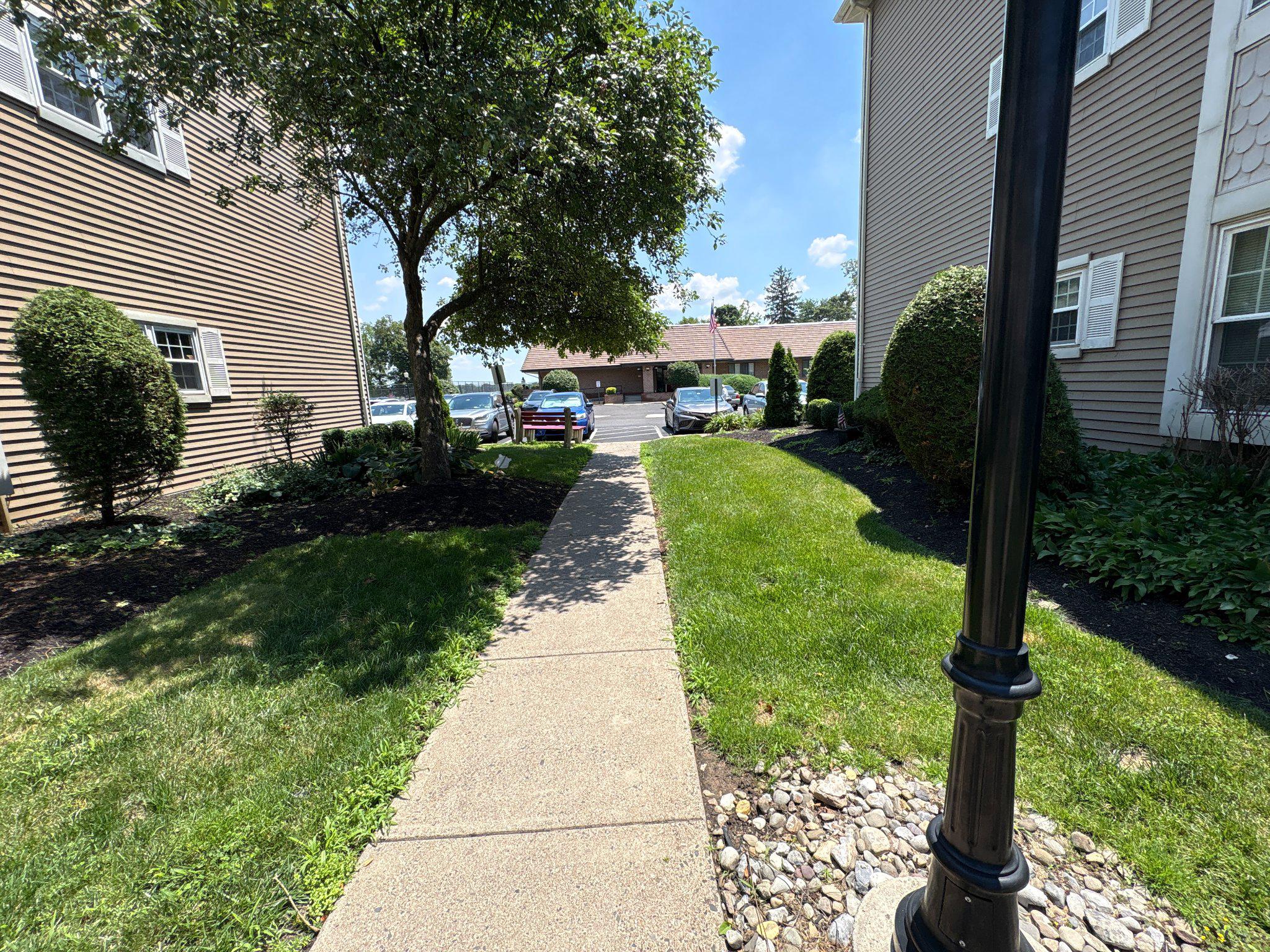 72304 Delaire Landing Road, Unit 304 Philadelphia, PA 19114 - Photo 4 of 56 Charming pathway through lush greenery.