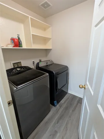 a utility room with washer and dryer