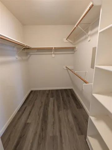 a view of an empty walk in closet