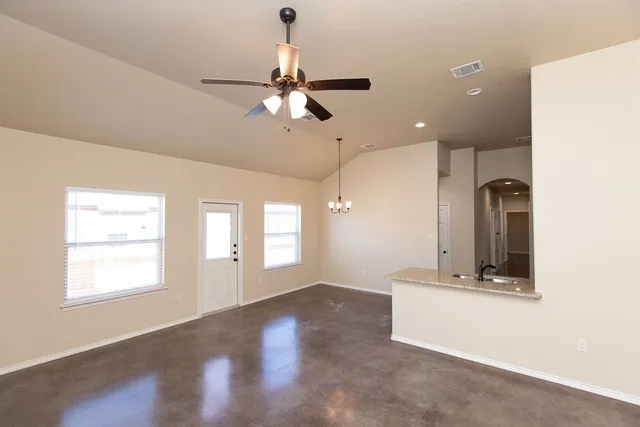 a view of a kitchen with a dishwasher and a large window
