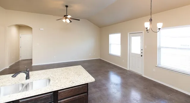 a view of a kitchen cabinets a sink and dishwasher with wooden floor
