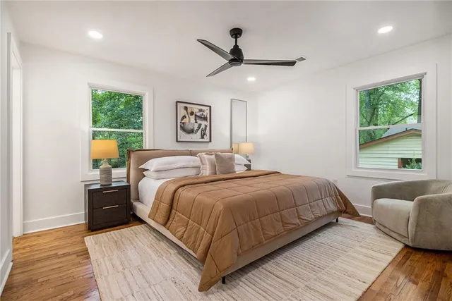 a bedroom with a bed and window