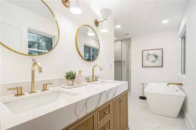 a bathroom with a double vanity sink and a mirror
