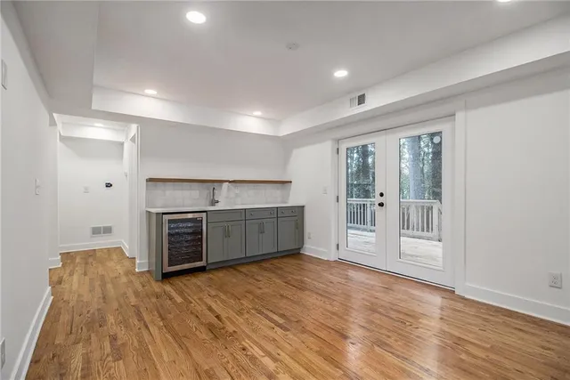 a view of a kitchen with a sink and a stove top oven