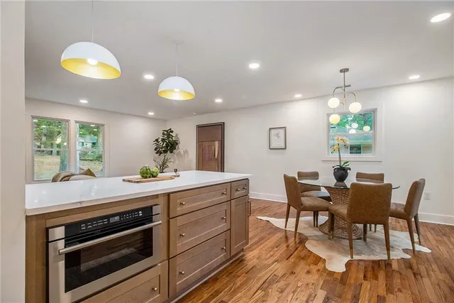 a kitchen with a table and chairs in it