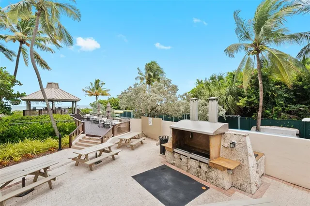 a view of backyard with a table and chairs