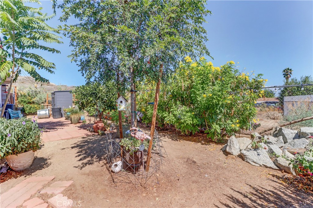 480 Deerhill Road Perris, CA 92570 - Photo 13 of 39 a view of a backyard with a patio