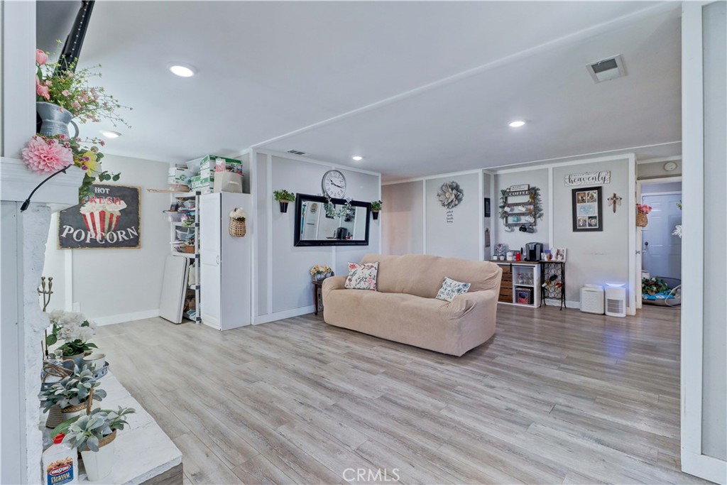 480 Deerhill Road Perris, CA 92570 - Photo 15 of 39 a living room with furniture and wooden floor