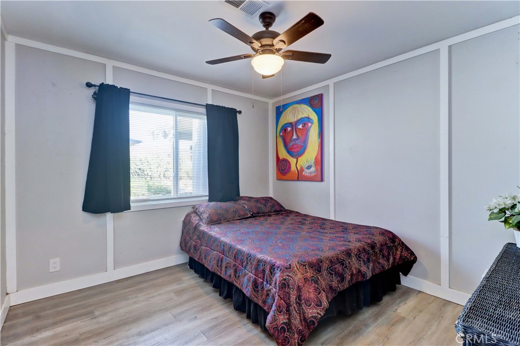 480 Deerhill Road Perris, CA 92570 - Photo 27 of 39 a bedroom with a bed and a window