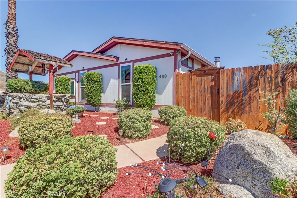 480 Deerhill Road Perris, CA 92570 - Photo 3 of 39 a front view of a house with a yard and outdoor seating