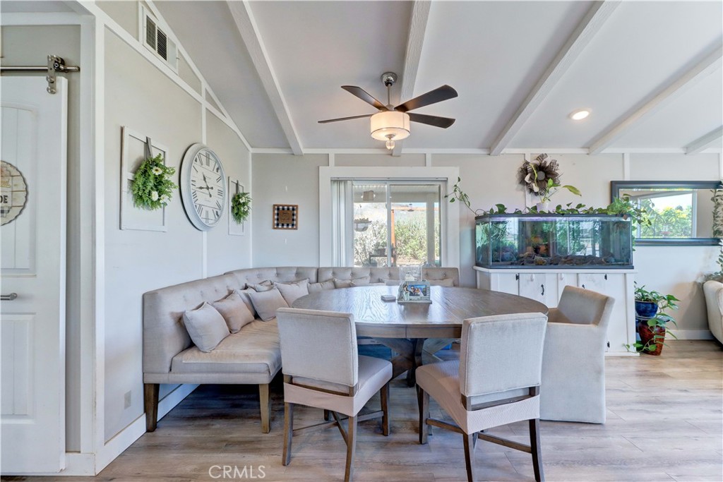 480 Deerhill Road Perris, CA 92570 - Photo 32 of 39 a view of a dining room with furniture window and wooden floor