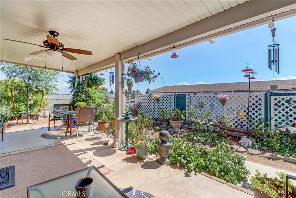 480 Deerhill Road Perris, CA 92570 - Photo 8 of 39 a view of a tables and chair and potted plants on the wall