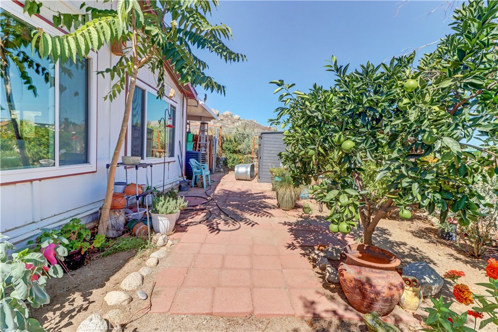 480 Deerhill Road Perris, CA 92570 - Photo 10 of 39 a backyard of a house with outdoor seating