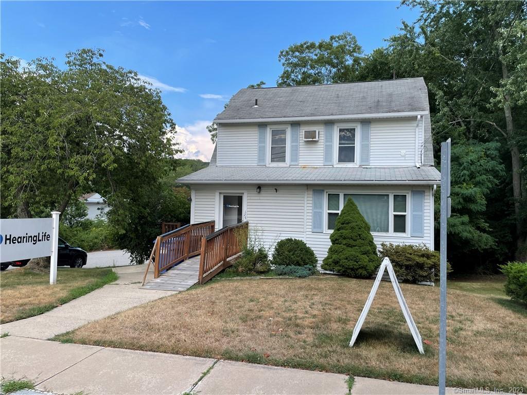 127 Oneco Street Norwich, CT 06360 - Photo 1 of 23 a front view of a house with a yard