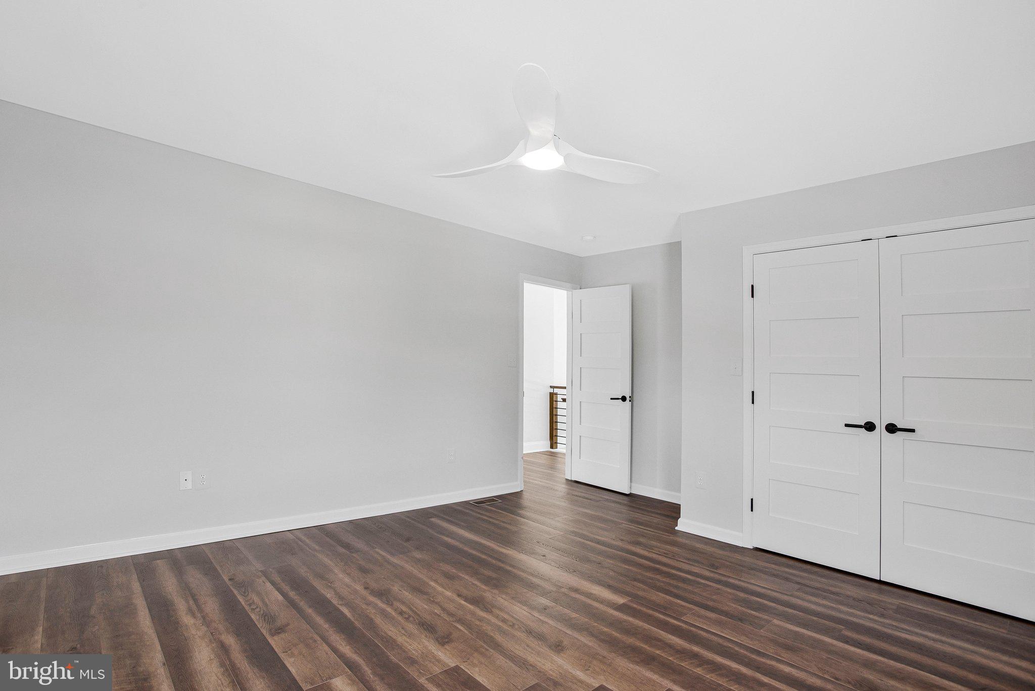 6146 Drum Point Road Deale, MD 20751 - Photo 44 of 75 a view of an empty room with wooden floor