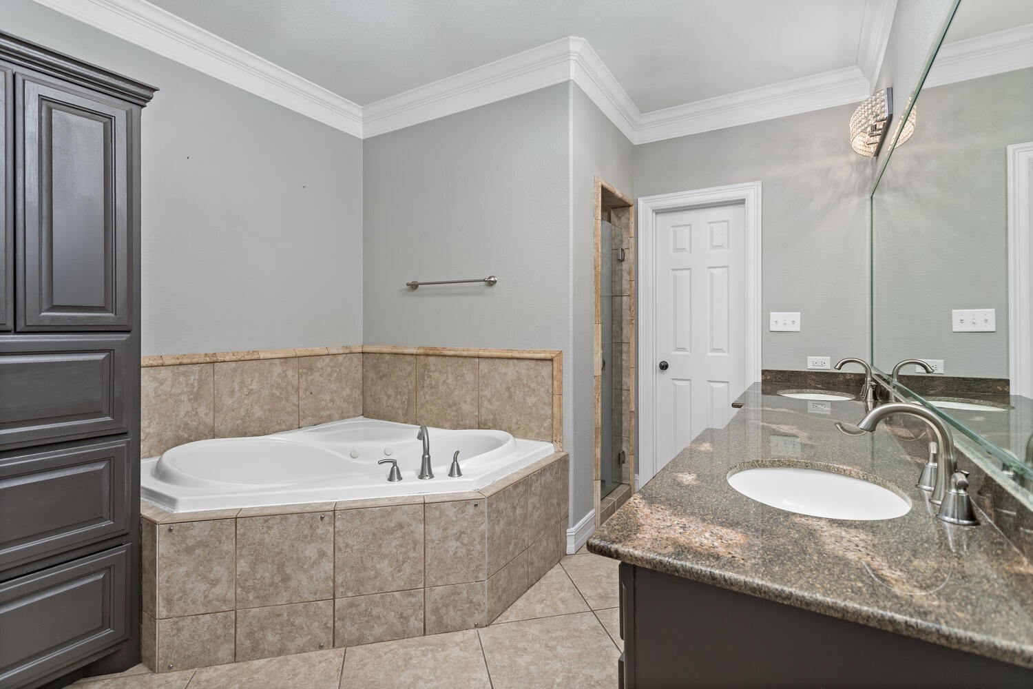 6461 Bell Pointe Beaumont, TX 77706 - Photo 22 of 33 a bathroom with a granite countertop bathtub sink and mirror