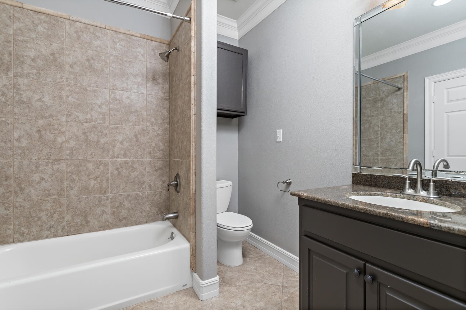 6461 Bell Pointe Beaumont, TX 77706 - Photo 31 of 33 a bathroom with a granite countertop sink toilet and shower