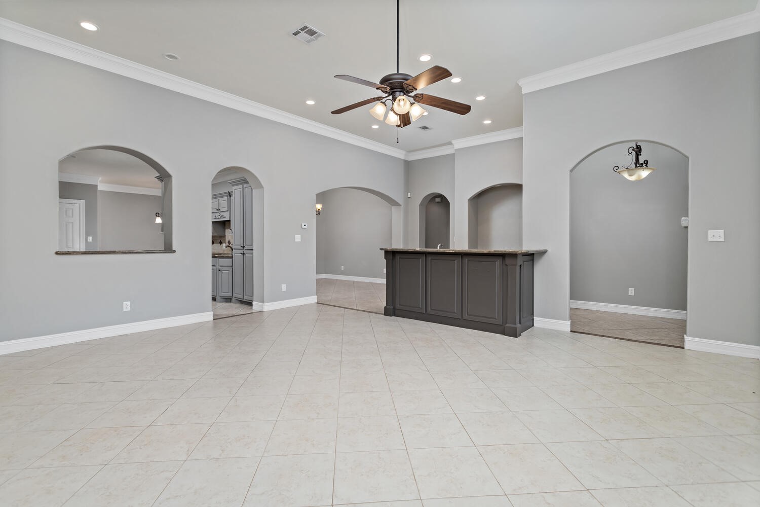 6461 Bell Pointe Beaumont, TX 77706 - Photo 6 of 33 an empty room with windows and cabinet