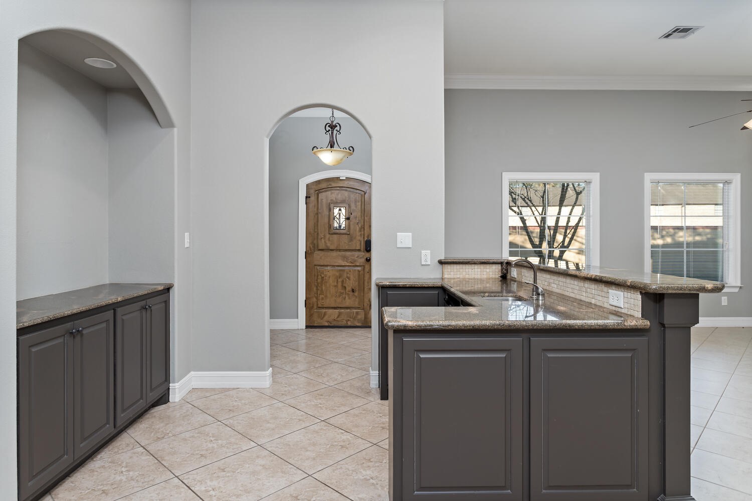 6461 Bell Pointe Beaumont, TX 77706 - Photo 9 of 33 a kitchen with granite countertop a sink and cabinets