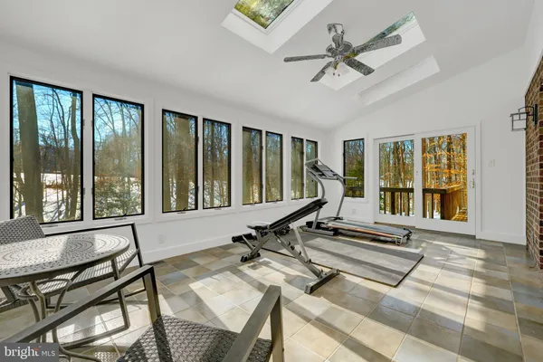 a living room with a large window and a table
